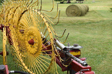 Wall Mural - Hay Rake with Hay Bales in the Background