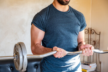 Wall Mural - Guy doing some training at home to keep in good shape