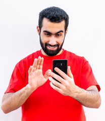guy taking selfie by his phone while smiling