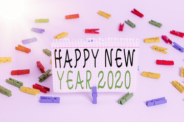 Wall Mural - Writing note showing Happy New Year 2020. Business concept for celebration of the beginning of the calendar year 2020 Colored clothespin papers empty reminder white floor background office