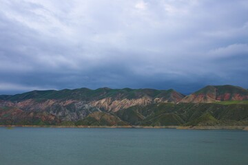 Canvas Print - Amazing shot of a mountain lake on a cloudy sky background in Armenia