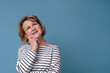 © Viktor Koldunov - Portrait of thoughtful elderly woman dreaming looking up. Studio shot