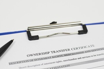 Canvas Print - Closeup shot of a pen over an ownership certificate