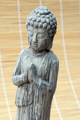 Canvas Print - Vertical closeup shot of a concrete Buddha statue