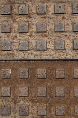 Wall Mural - Vertical shot of squares on rusty metal surfaces on top of each other