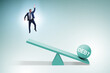 © Elnur - Debt and loan concept with businessman and seesaw