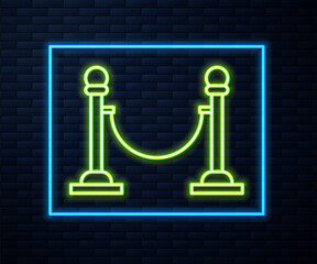 Glowing neon line Rope barrier icon isolated on brick wall background. VIP event, luxury celebration. Celebrity party entrance.  Vector Illustration