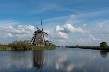 windmills in the netherlands along a canal