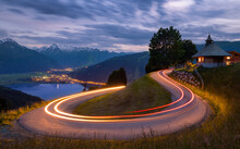 Curvy serpentine road through Austrian Alps mountains. Long exposure showing the movement of traffic in Zell am See, Austria.