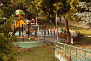 Playground without kids. Empty play area in the big park. 