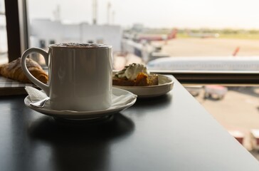 Hot coffee with breakfast at airport lounge.