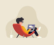 © Mascha Tace - Relaxed man in a lounge chair working on a laptop. Stress free job vector concept illustration with male character working from home or other comfortable place