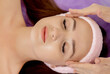 © volody10 - spa, resort, beauty and health concept - beautiful woman in spa salon getting face treatment