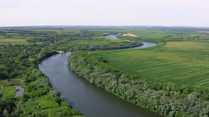 Wall Mural - Beautiful green summer nature landscape with river and meadows, aerial view drone shot