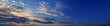 © ArturSniezhyn - Sky at sunset with dark clouds, panoramic big shot. Background from the cloudy sky