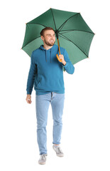 Canvas Print - Handsome young man with umbrella on white background