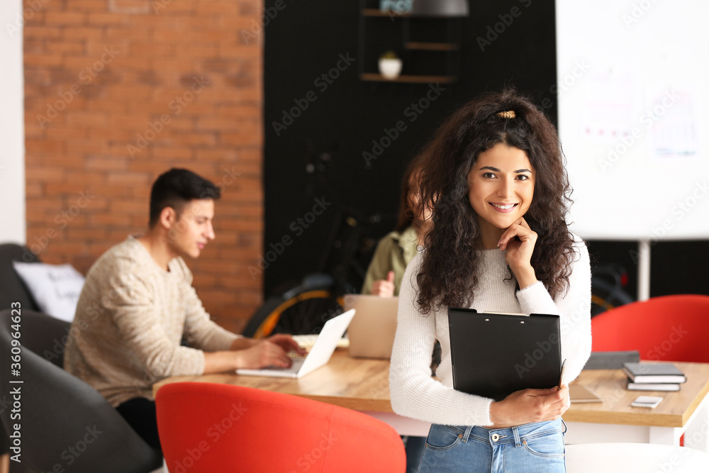 Young businesswoman working in office