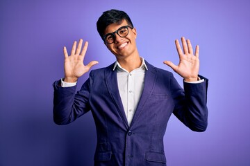 Poster - Young handsome business man wearing jacket and glasses over isolated purple background showing and pointing up with fingers number ten while smiling confident and happy.