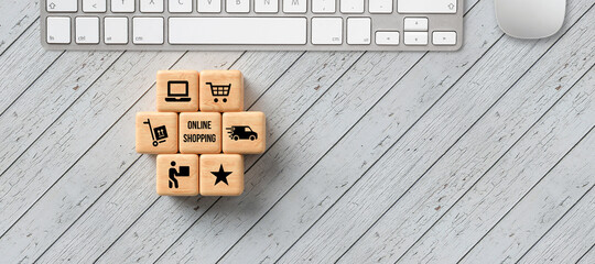 Wall Mural - cubes with message ONLINE SHOPPING and shopping cart symbols on wooden background