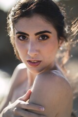 Poster - Vertical portrait of a young caucasian brunette female with dark brown eyes