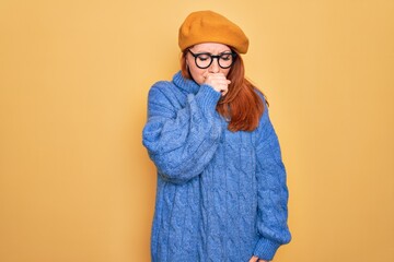 Poster - Young beautiful redhead woman wearing french beret and glasses over yellow background feeling unwell and coughing as symptom for cold or bronchitis. Health care concept.