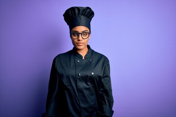 Poster - Young african american chef girl wearing cooker uniform and hat over purple background looking sleepy and tired, exhausted for fatigue and hangover, lazy eyes in the morning.