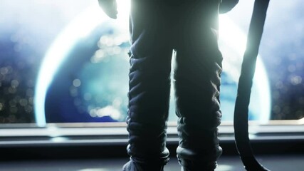 alone astronaut in futuristic space corridor, room. view of the earth. cinematic 4k footage.