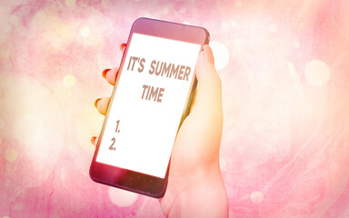 Text sign showing It S Summer Time. Business photo showcasing season for fun and excitement enjoying the sunny weather Modern gadgets with white display screen under colorful bokeh background