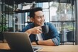 © Mallika - Smart Asian man working with laptop laptop.