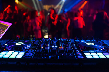 Wall Mural - music controller DJ mixer in a nightclub at a party