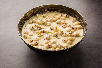 Wall Mural - Sweet Roasted Makhana Kheer is an Indian dessert recipe, served in a bowl garnished with dry fruits