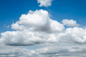 Wall Mural - blue clear sky with white fluffy clouds. natural background