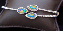 White Gold Bangle
Adorned With Opals