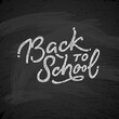Back to school text drawing by white chalk in blackboard with school items and elements. Vector illustration banner.