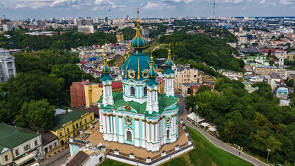 Aerial drone view of Saint Andrew's church and Andreevska street from above, cityscape of Podol district, city of Kiev (Kyiv), Ukraine
