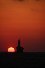 Sunrise at the lighthouse of Tourlitis at Andros, Greece 