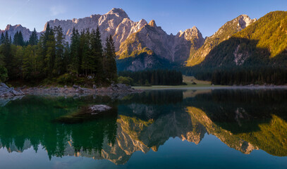 Wall Mural - Panorama of an alpine lake on a beautiful sunny morning