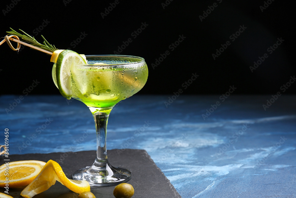 Glass of tasty martini cocktail on table