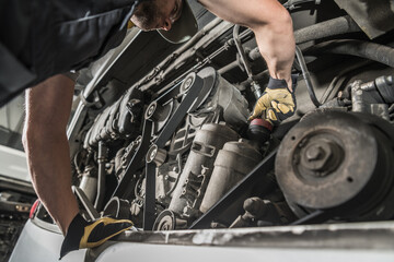 Auto Mechanic Repairing Bus Engine.