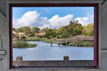 Wall Mural - Beautiful view of a lake and a rural area from a window