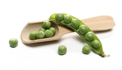 Wall Mural - Green peas with opened pod and wooden spoon isolated on white background