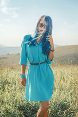 Poster - Beautiful blue hair woman walking in summer nature.