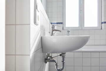 Canvas Print - Wash basin with faucet in bright white bathroom