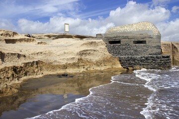 Wall Mural - Ruins of an ancient building on the beach captured in Tenerife island