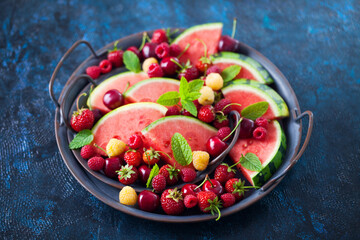 Wall Mural - delicious summer fruits on one plate