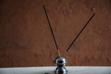 Picture of two black color incense sticks or joss sticks