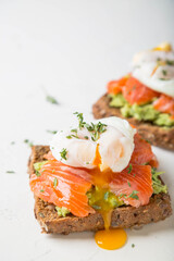 Wall Mural - Sandwich with salmon, avocado and whole grain bread