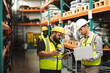 © Wavebreak Media - Two male factory workers discussing over a clipboard at the factory