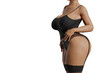 Sexy plus size model in black lingerie