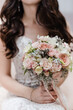 © lelya198814 - bride holds a bouquet, bridal bouquet of pink roses, wedding day, bride fees